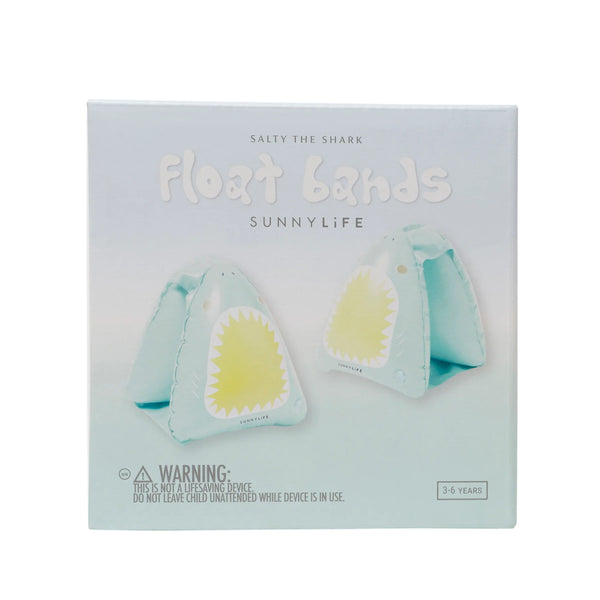 Sunnylife Float Bands product packaging for 'Salty the Shark', showing two light blue triangular float bands with yellow shark teeth designs on a pale blue background.