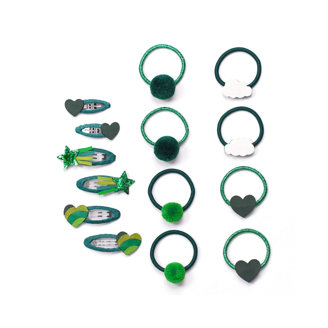 A set of hair accessories for girls, including green glitter hair ties with pom-poms and cloud charms, dark green elastic bands, and several hair clips in green, white, and gray.