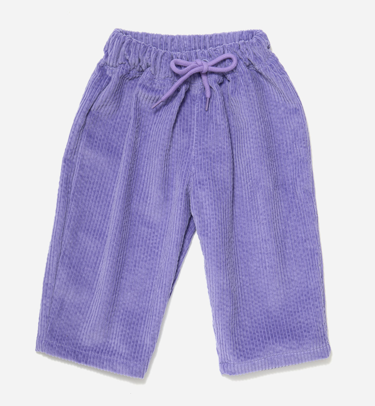 Lilac corduroy organic cotton kids trousers with a tapered leg, an elastic waistband and drawstring, laid flat on a light gray background.
